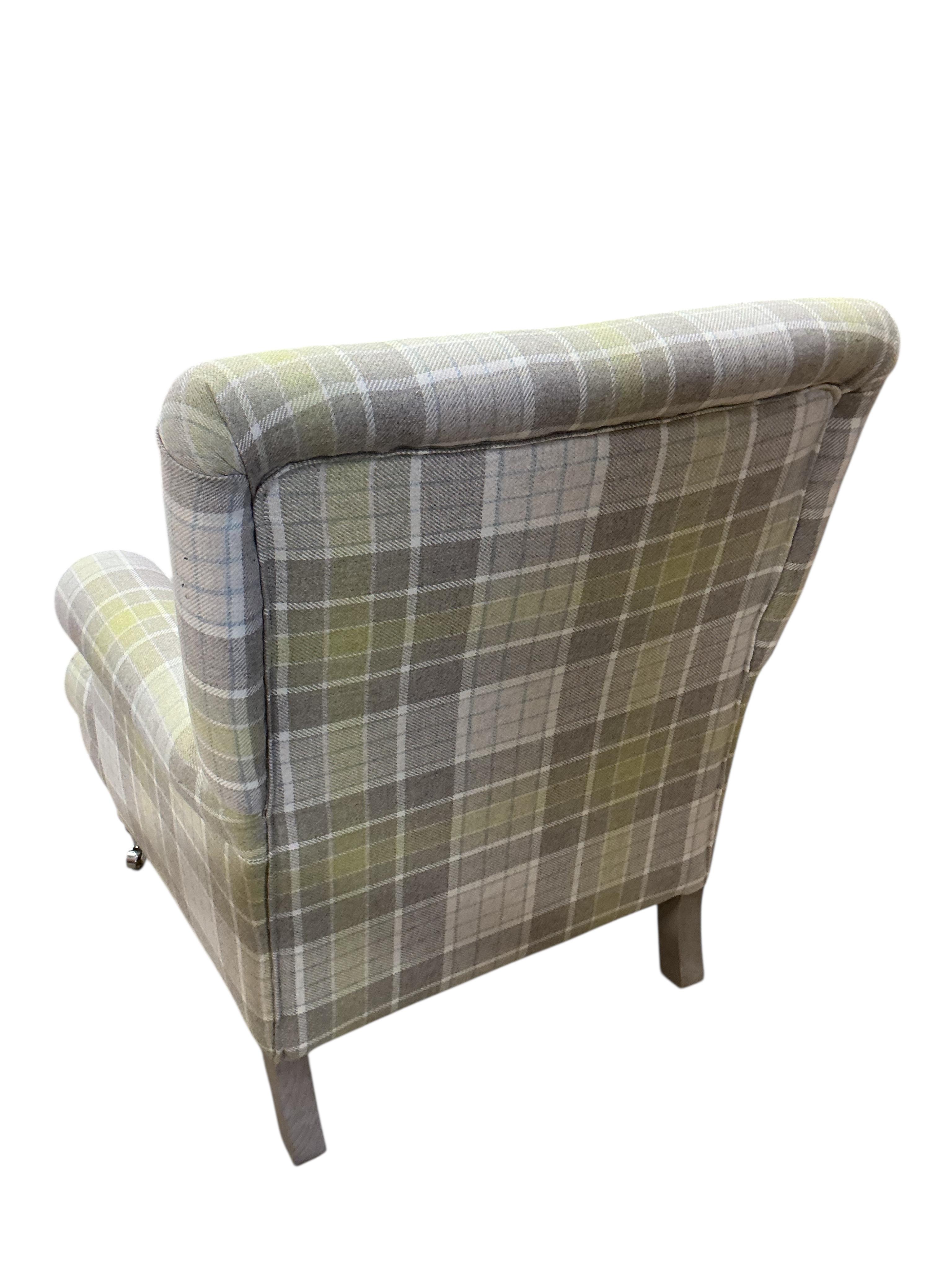 A modern Victorian style wing armchair upholstered in tartan type fabric, width 76cm, depth 76cm, height 90cm